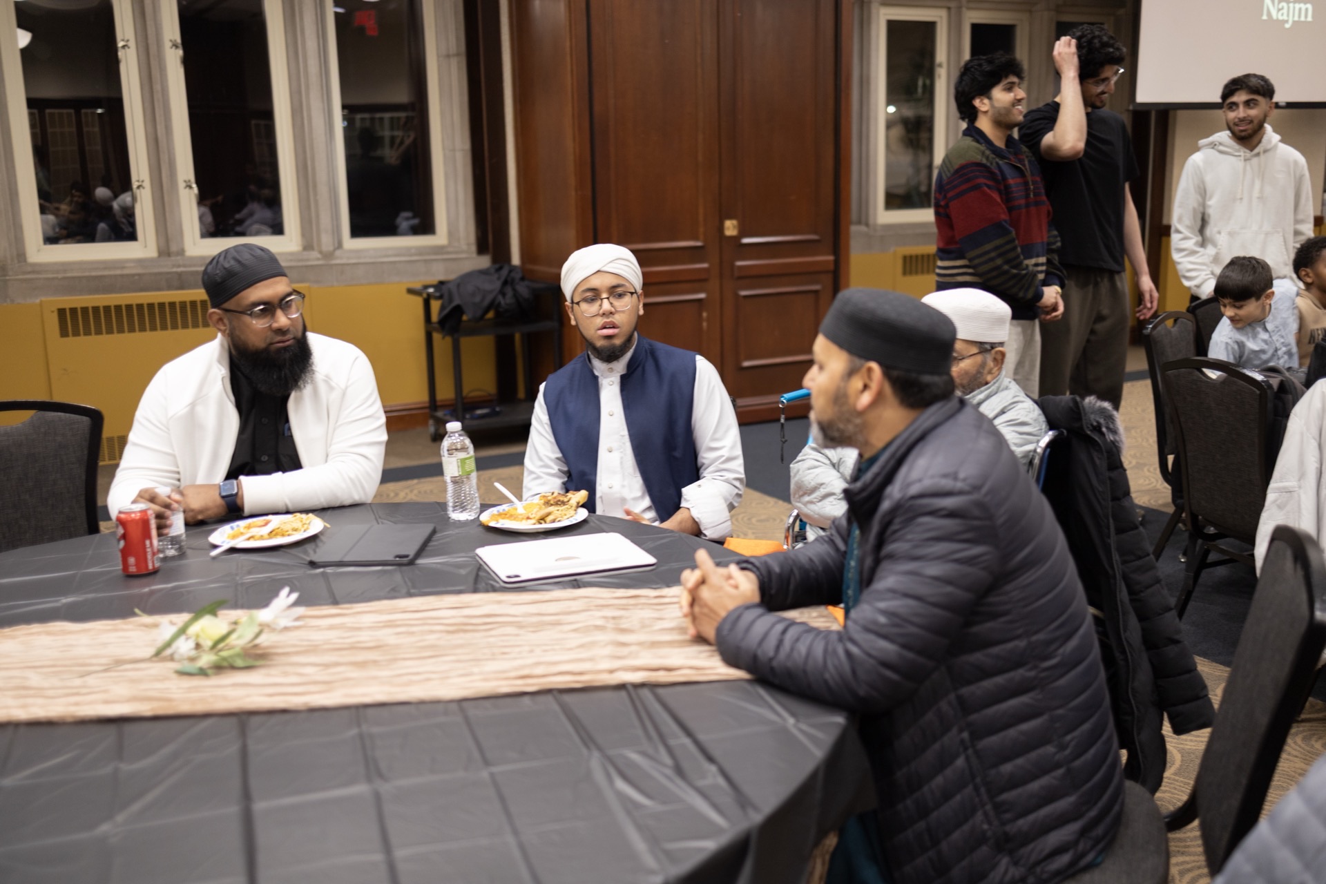 Scholars and community members in conversation at a Najm halaqah